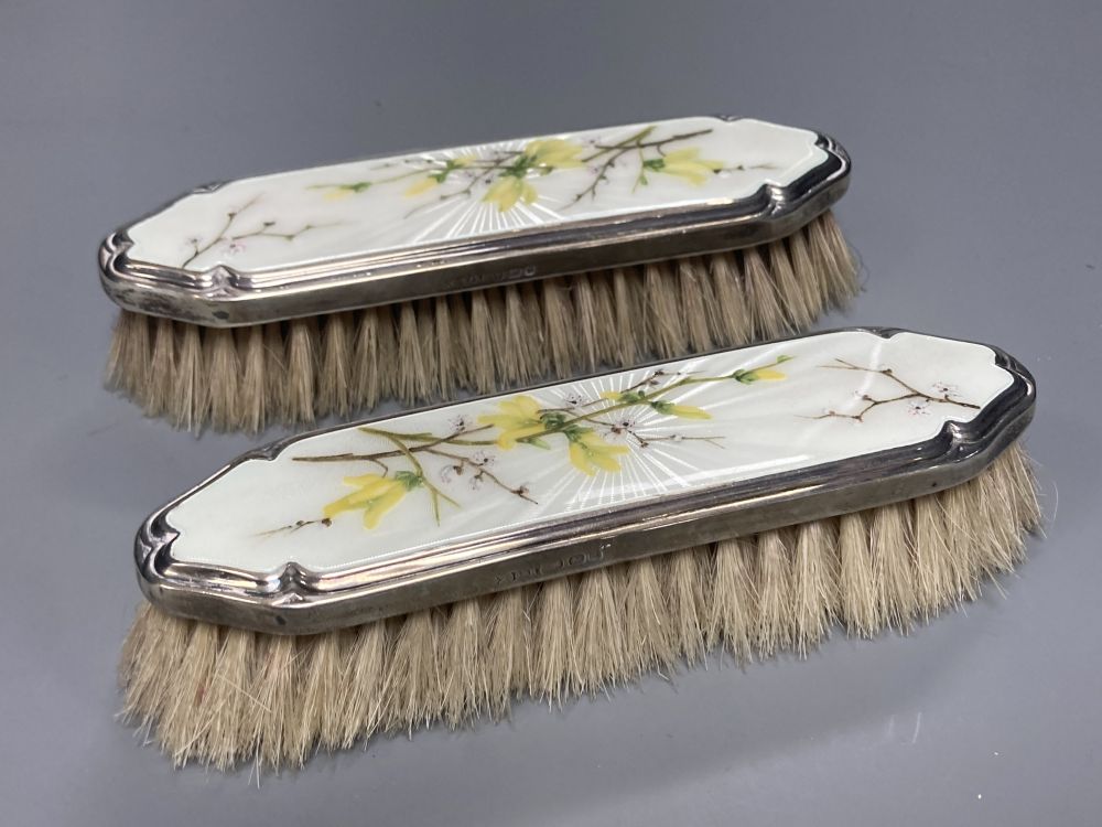 A 1950s silver and enamel five piece mirror and brush set, S.J Rose & Son, London, 1954.